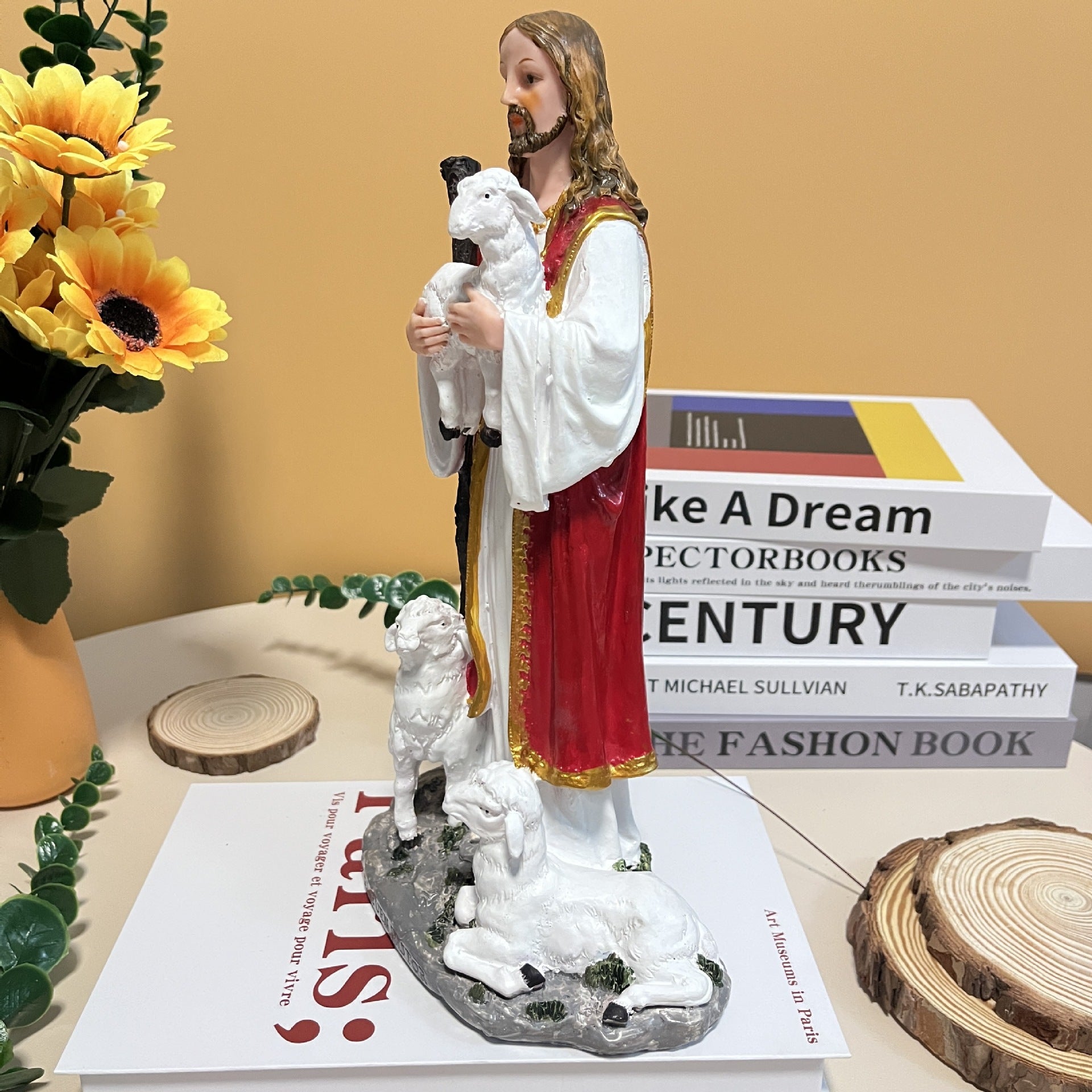 Detailed view of shepherd figure in traditional nativity resin sculpture