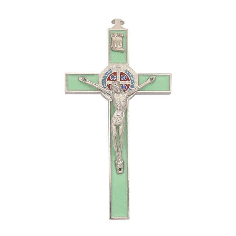 Detailed view of Jesus icon engraved on luminous green Catholic cross pendant
