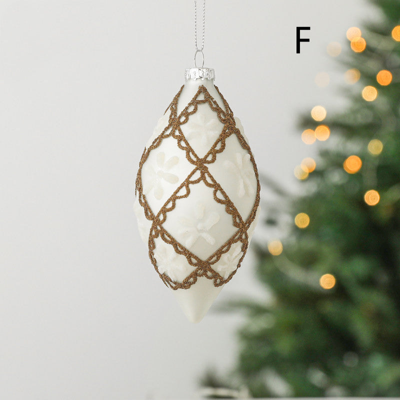 Hand-painted glass Christmas ornament with diamond shape on Christmas tree