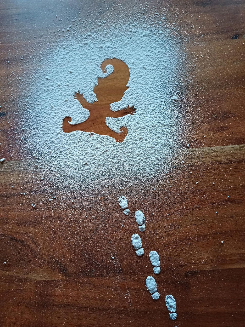 Festive wooden decorations arranged on snowy surface