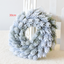 Snowflake Pine Cone Christmas Wreath on display for festive home decor