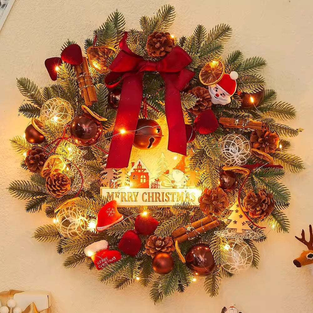 Christmas wreath with decorative bow and pine cones for holiday door display