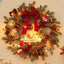 Christmas wreath with decorative bow and pine cones for holiday door display