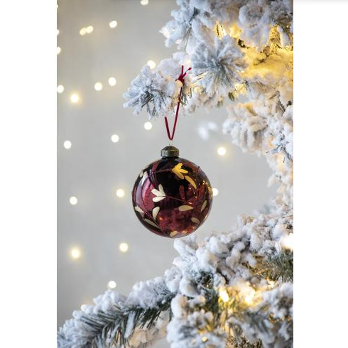 Red glass ball ornament with sparkling glitter accent details