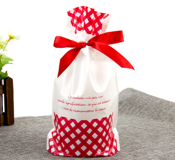 Christmas Santa and tree themed drawstring bags arranged together
