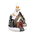 Holiday village house ornament with warm festive styling