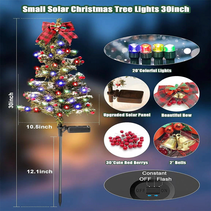 Solar Christmas tree stake light brightening a backyard patio area during evening Christmas celebration