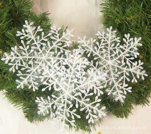 Plastic snowflake Christmas ornaments hanging together
