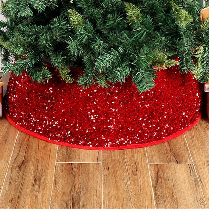 Close-up of red paillette sequins on Christmas tree skirt fabric texture