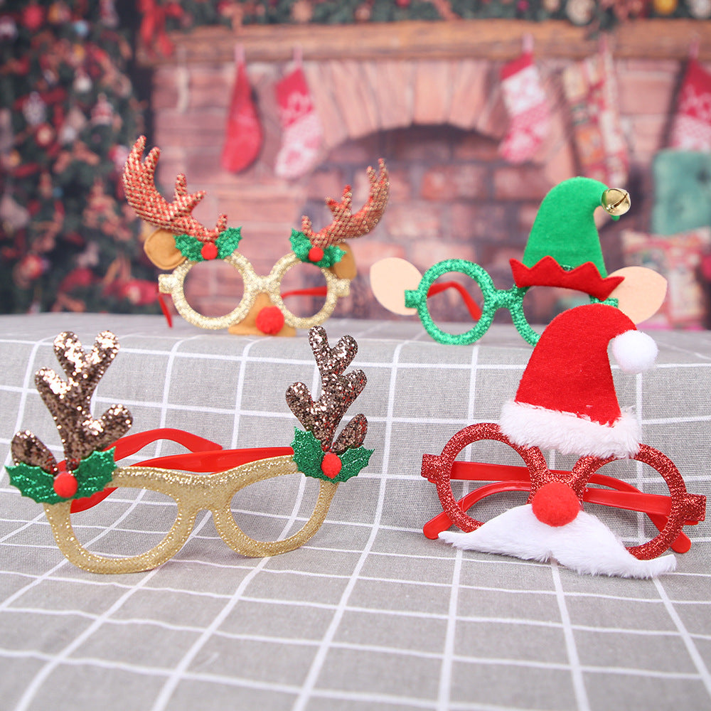 Red frame Christmas deer antler glasses close-up - festive holiday accessory