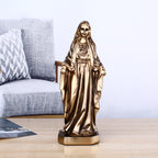 Bronze-tone resin Jesus ornament with child in gentle embrace, representing divine love