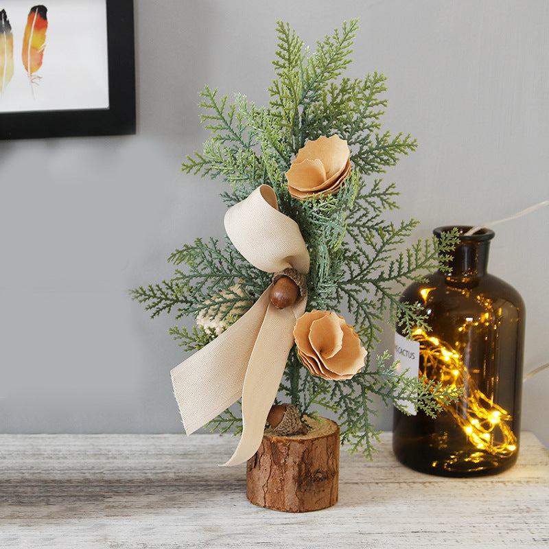 Small wrought iron Christmas tree ornament on display in a warm home setting