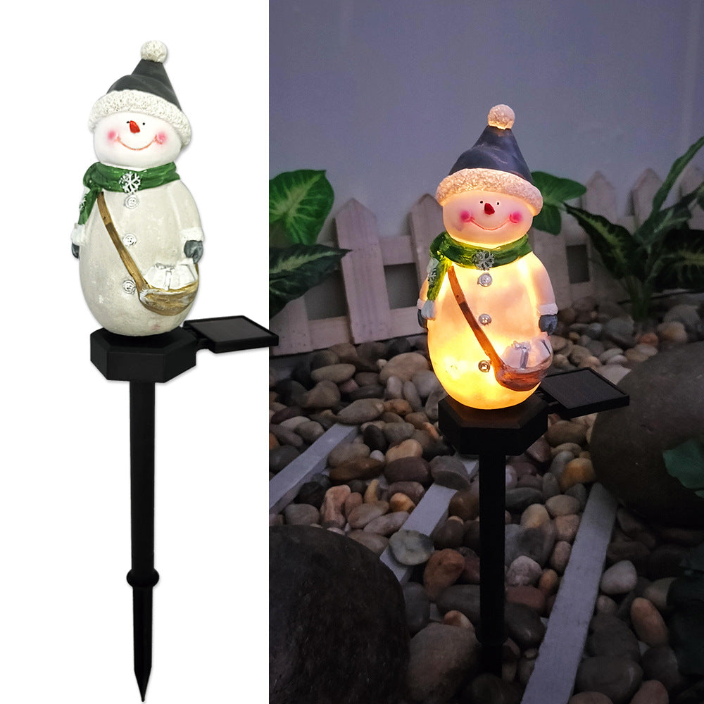 Outdoor solar lamp displaying Christmas illumination in garden