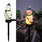 Outdoor solar lamp displaying Christmas illumination in garden