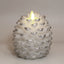 Brown pinecone candle on textured surface with warm ambient lighting, Pinecone Christmas Candle, faith