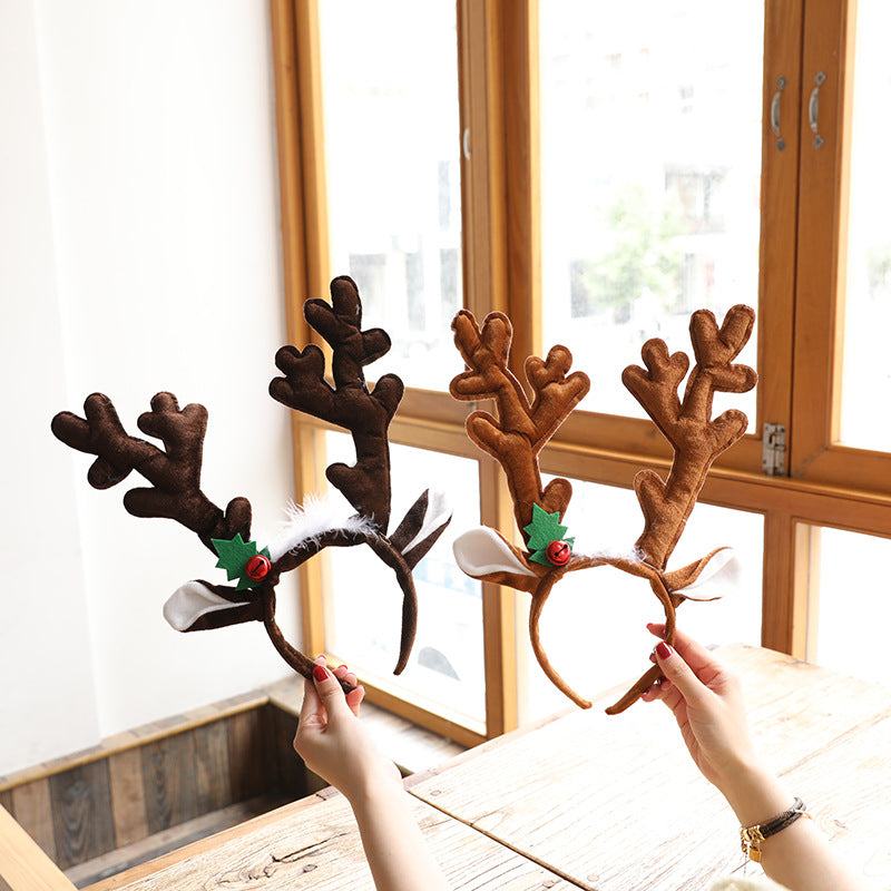 Festive Christmas headband with deer antlers close-up view