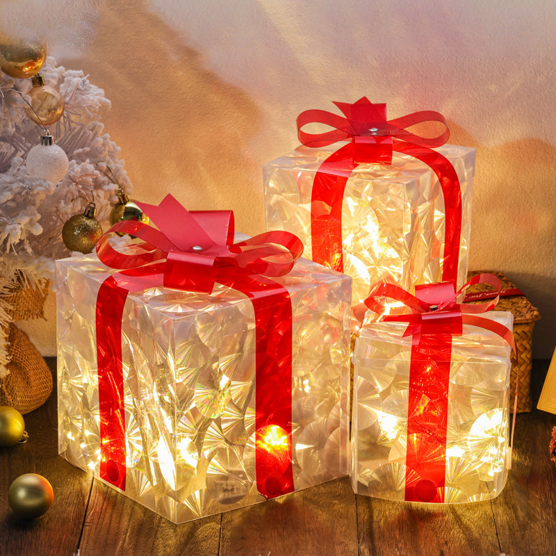 Festive luminous Christmas Gift Box in traditional holiday colors