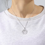 Steel-tone Jesus pendant worn by model