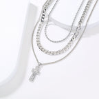 Jesus cross necklace styled on model, showing 43-55cm chain length