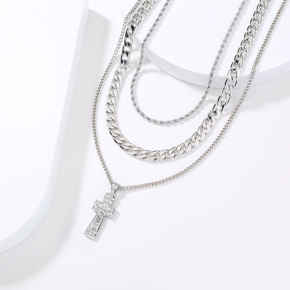 Jesus cross necklace styled on model, showing 43-55cm chain length
