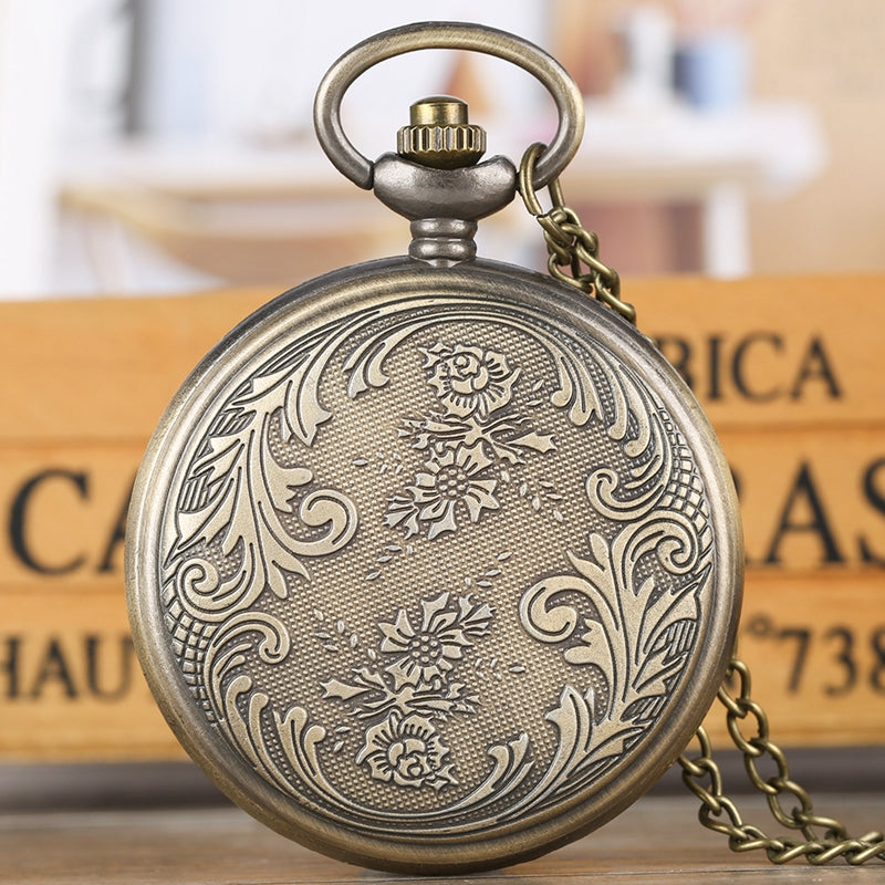 Round pocket watch face showing Virgin Mary and Jesus religious motif in silver-tone metal