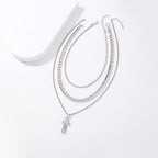 Multi-layer zinc alloy cross necklace with electroplated finish, front view
