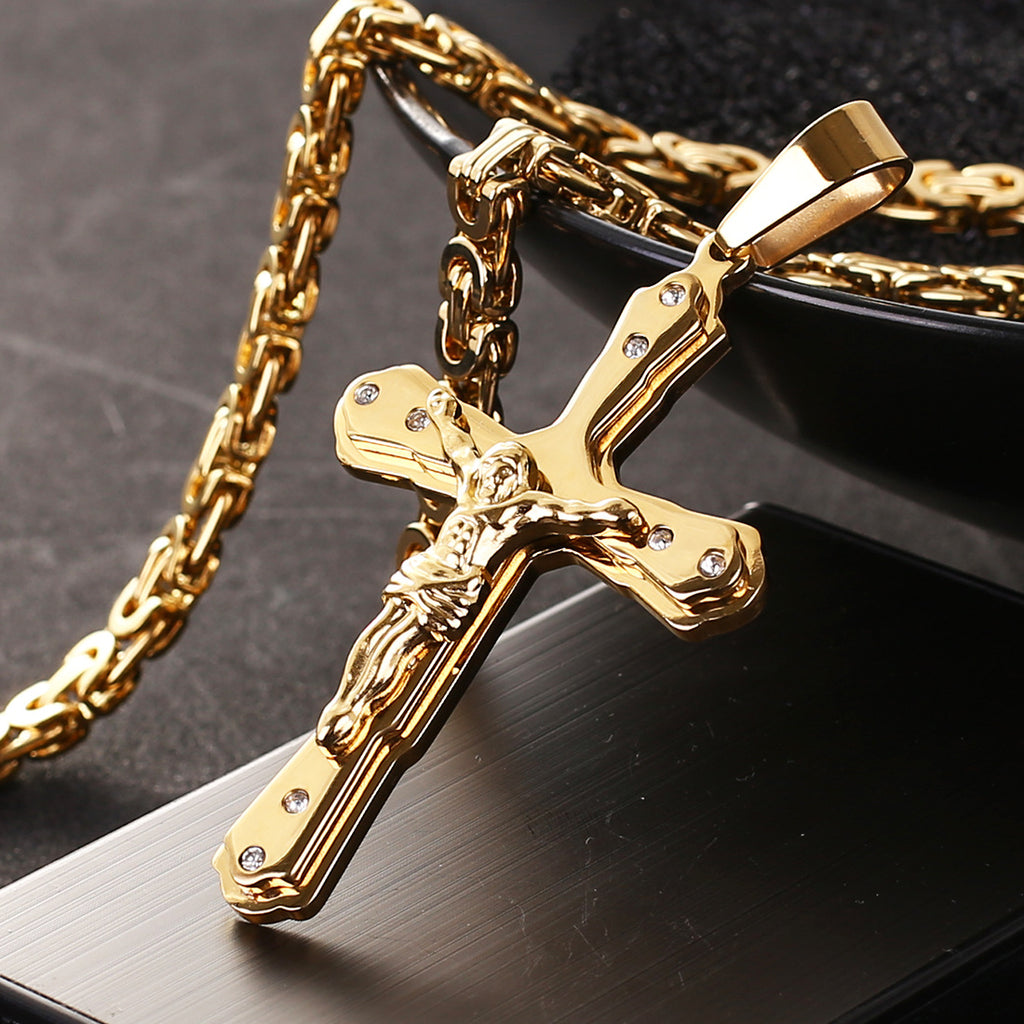 Jesus cross pendant displayed on chain against neutral surface, representing Christian grace