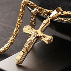 Jesus cross pendant displayed on chain against neutral surface, representing Christian grace