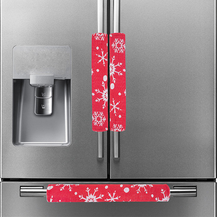 Set of 3 festive Christmas handle covers arranged together, red and green holiday kitchen accessories
