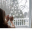 Intricate snowflake design on glass surface with holiday ambiance