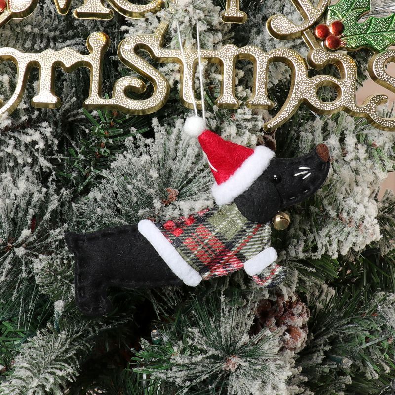 Whimsical dressed dog pendant capturing the faithful companion spirit of Christmas
