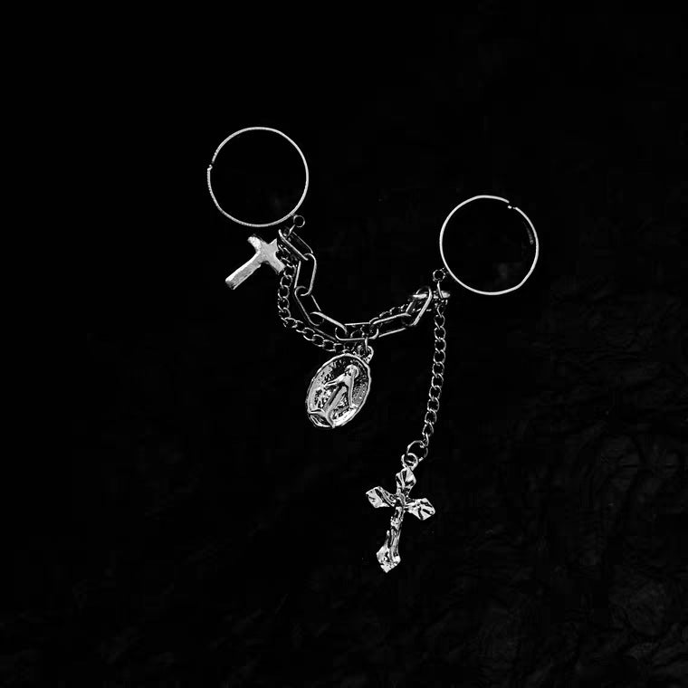 Woman wearing vintage cross double finger ring as a faith statement accessory