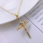 Elegant gold-plated cross pendant with shimmering zircon details