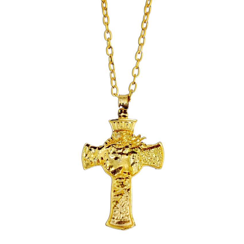 Close-up of crucifix pendant with thorn crown detail