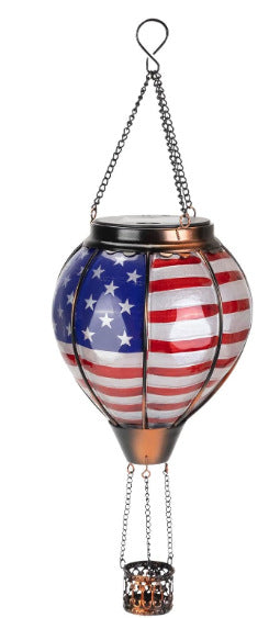 Solar powered LED lantern in festive Christmas style for yard decoration
