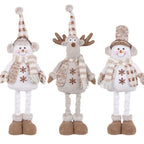 Close-up of cloth snowman figures in retractable window scene decoration