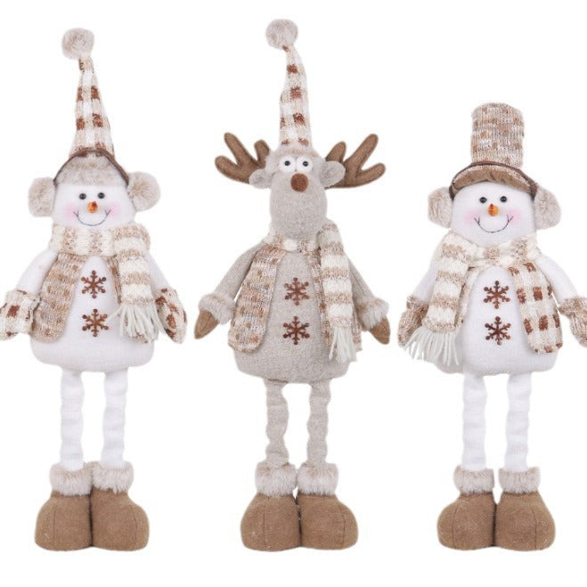 Close-up of cloth snowman figures in retractable window scene decoration