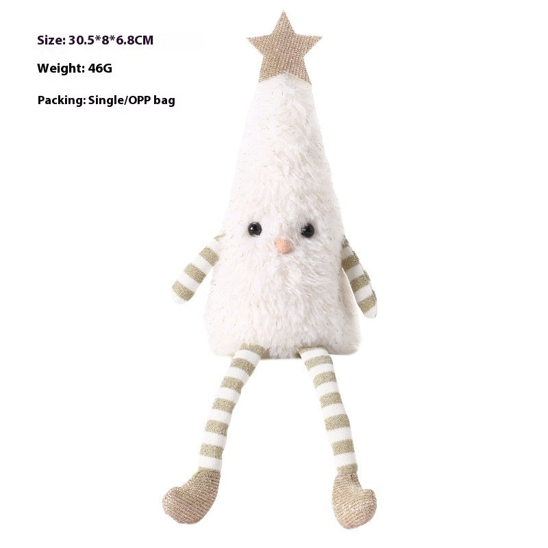 Set of cute plush doll Christmas ornaments displaying on a festive holiday tree