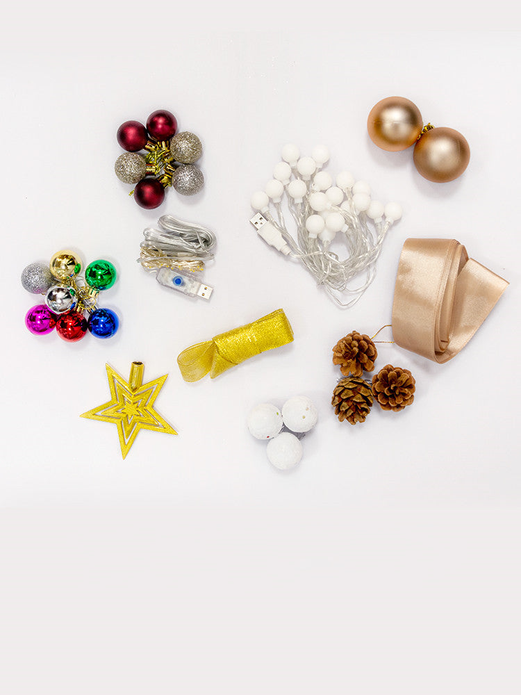 Close-up of folded paper Christmas tree ornament showing crisp edges