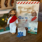 Finding God paper ornament placed near a Bible and candle for Advent reflection, Christian home decor