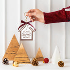 Wooden Christmas pendant displayed as holiday tree decoration