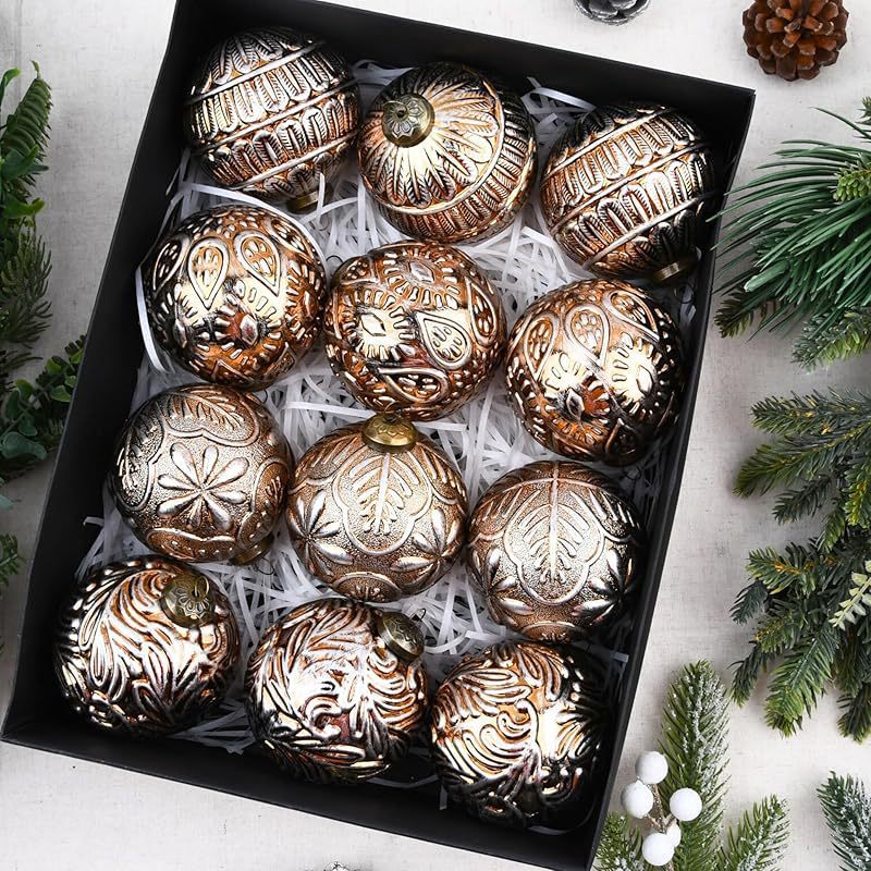 Christmas ornament balls in brown white gold against rustic surface