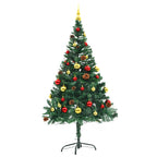 Pre-lit artificial Christmas tree displaying festive ornaments and warm lighting