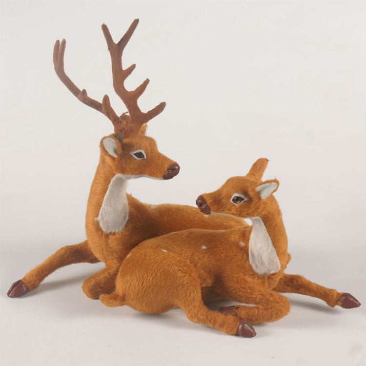 Close-up of a small flocked deer ornament showing fabric texture detail