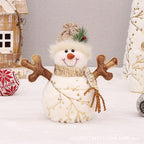 Set of various sized velvet snowman decorations with different hat styles