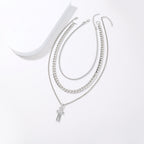 Multi-strand silver-tone necklace with cross pendant and extension chain