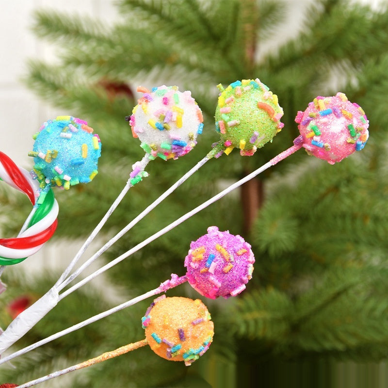 Whimsical macaron colored twig arrangement displayed as Christmas tree topper accent piece