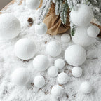 Close-up of a soft white foam snowball ornament on a red backdrop