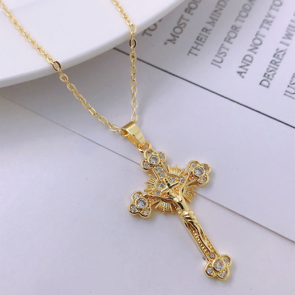 Close-up detail of the copper cross pendant and chain clasp
