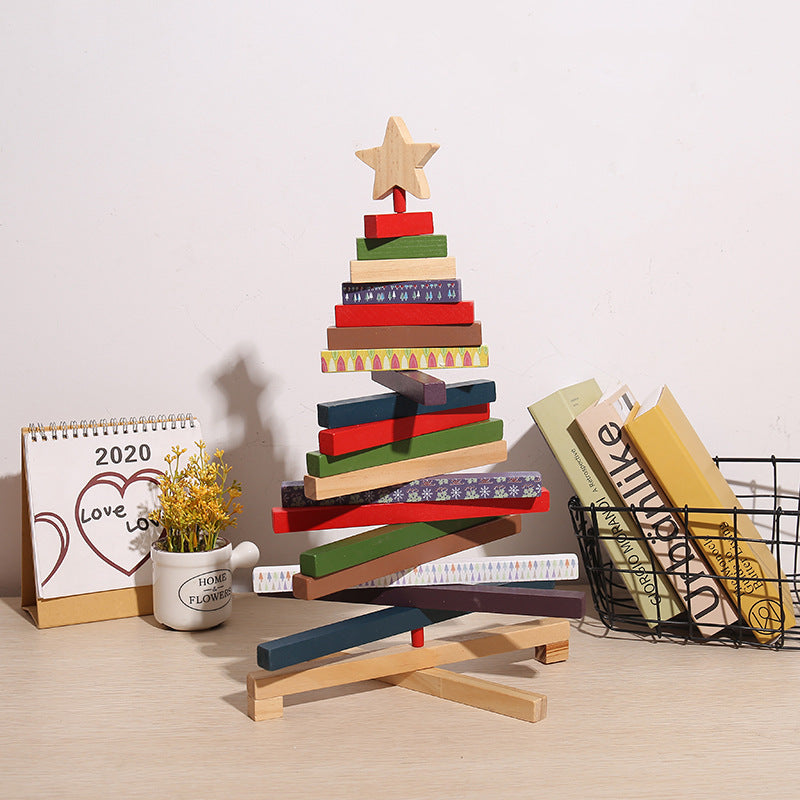 Holiday desktop scene with Christmas building block ornament and seasonal accents